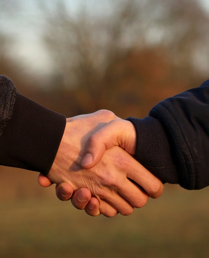 photo of a handshake upclose indicating trust and honesty